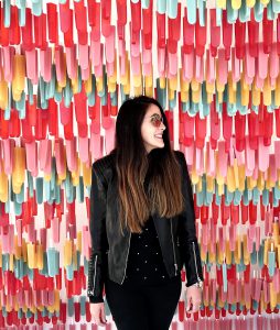 Cristina Serarols with artwork made from plastic straws