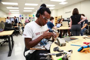 Student using tools at Makers Lab