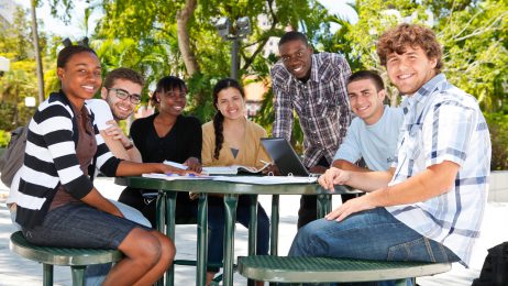 diverse students at a table