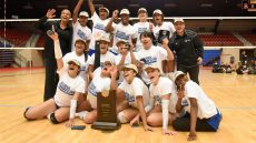 winning volleyball team with trophy