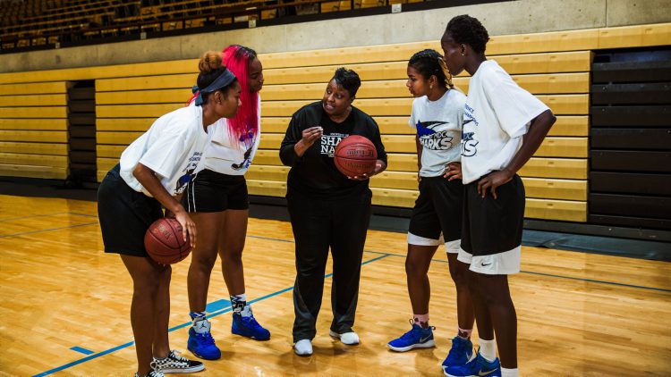 Coach Summons talks to her players