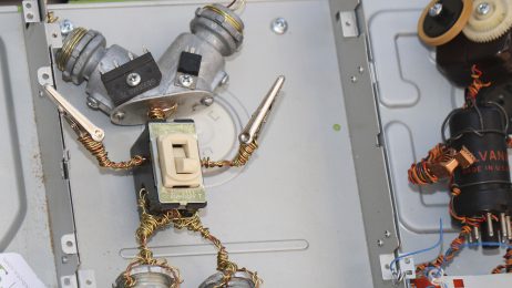 small robotic figures made from scrap