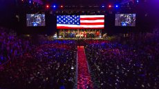 Thousands of students attending commencement in auditorium