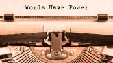 Vintage typewriter with the text "Words have power"