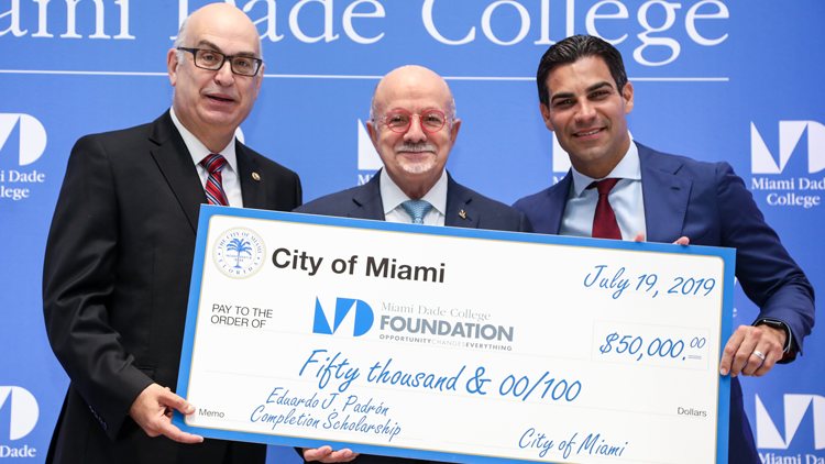 Check presentation to Dr. Eduardo J. Padrón with City Manager Dr. Emilio T. Gonzalez and City of Miami Mayor Francis Suarez