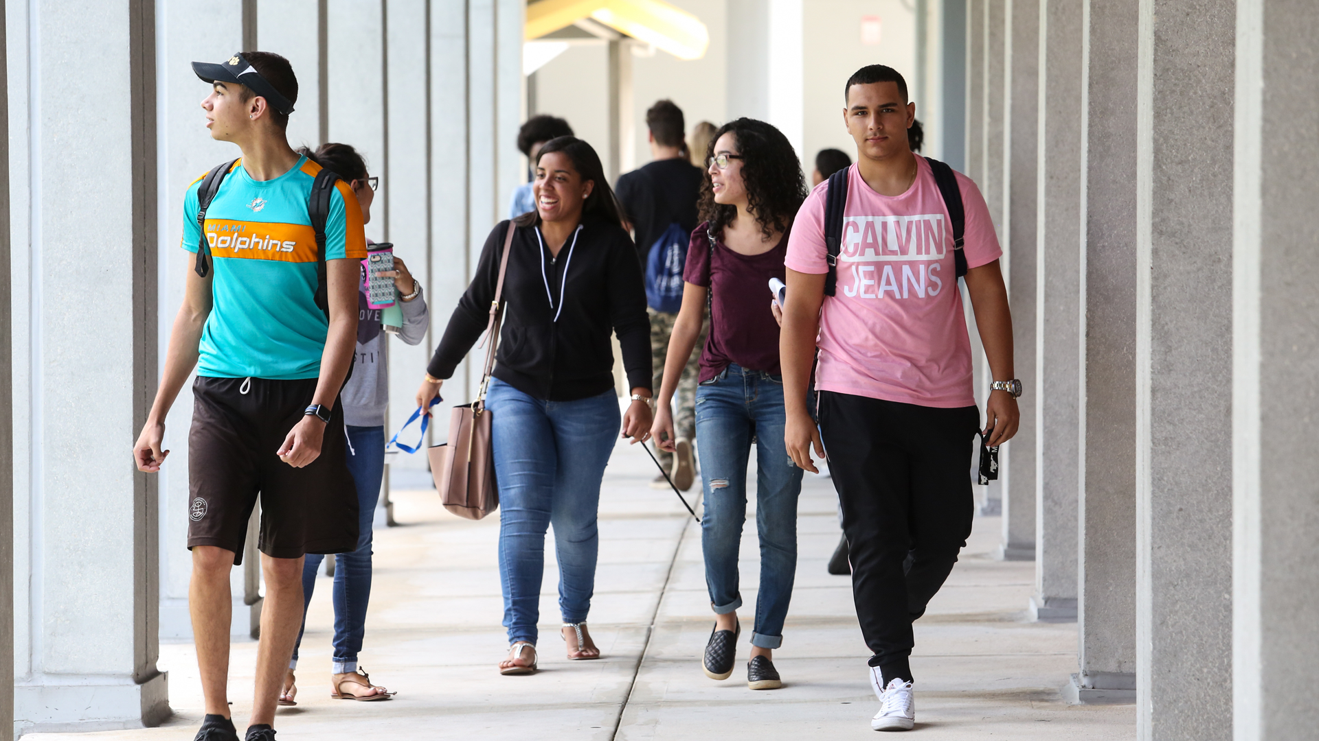 MDC students walking on campus hallway