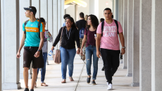 MDC students walking on campus hallway