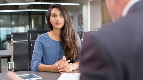 female student speaking with advisor