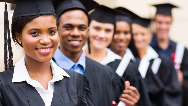Black students in caps and gowns