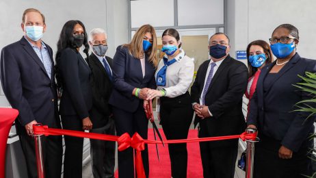 College president and administrators cutting ribbon