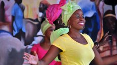 Haitian woman in traditional dress dancing