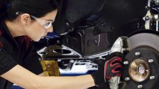 Young woman working on auto repair