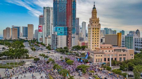 An aerial shot of a large crowd in front of the Freedom Tower