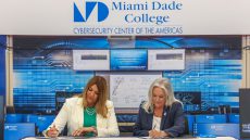 MDC President Madeline Pumariega and Uniersity of West Florida President Martha D. Saunders at a table signing agreement