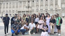 Group of NWSA college students posing with their teacher in front the Royal Palace, Madrid Spain