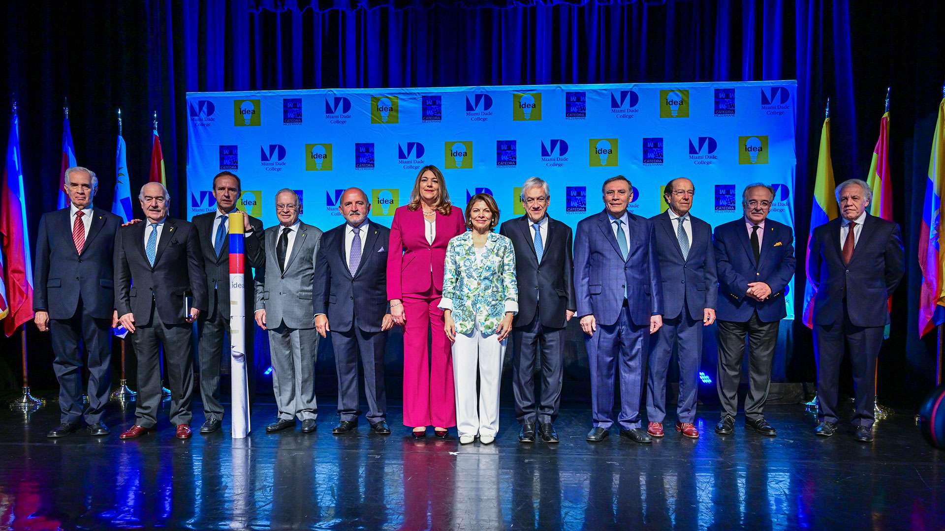 Global leaders on stage with the College president