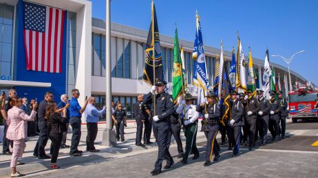 Marching with flags at building opening