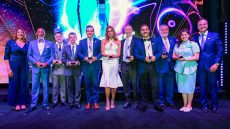 MDC president standing with the Hall of Fame inductees
